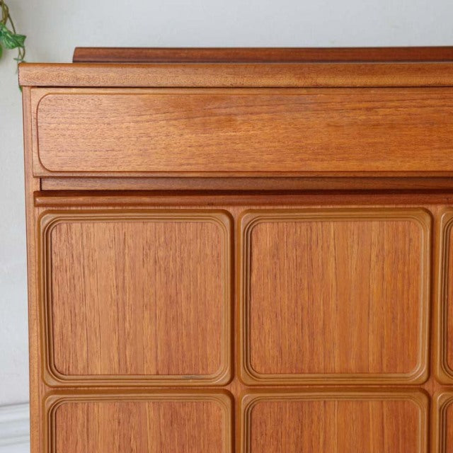 Mid-century British vintage teak McIntosh sideboard with rounded square panel doors and visible wood grain.
