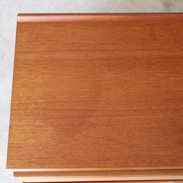 Vintage British mid-century teak McIntosh sideboard top showing rich wood grain and smooth finish.