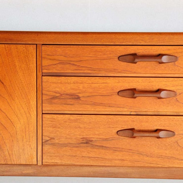 Vintage teak sideboard by British brand Nathan, mid-century Danish design with smooth wood grain and rounded handles on.