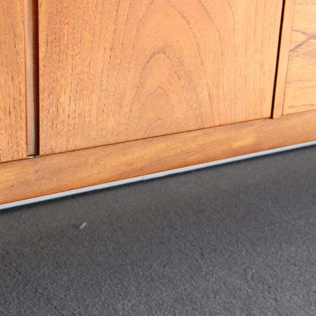 Vintage teak sideboard by Nathan showcasing smooth wood grain and clean mid-century British design with subtle Danish.