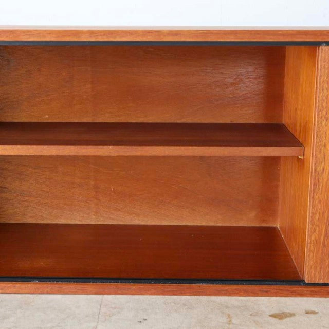 Vintage teak Avalon lowboard cabinet interior with rich wood grain and mid-century British-Danish design.