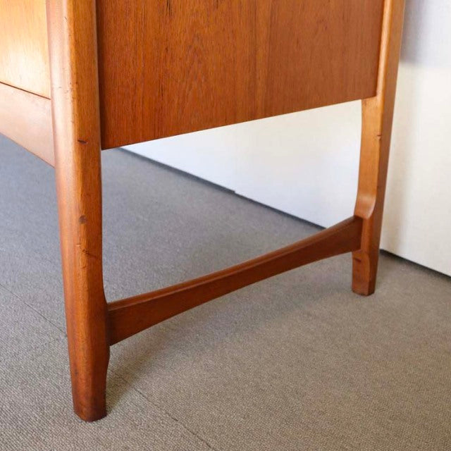 Mid-century teak sideboard leg and lower panel by British brand Nathan with visible wood grain and sleek Danish design.