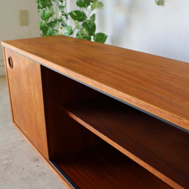 Vintage teak AVALON lowboard with rich wood grain, mid-century British-Denmark design, sliding door, and tapered legs.