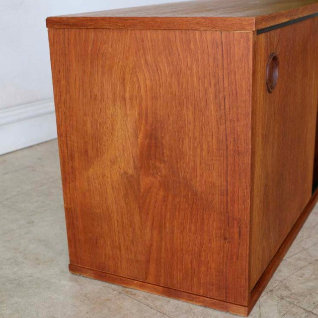 Vintage Avalon teak lowboard with rich wood grain, round cutout handles, British mid-century design, slender legs from.