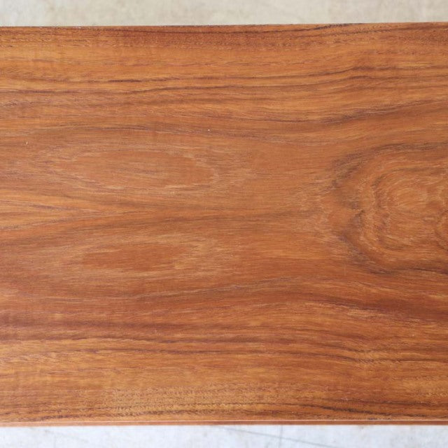 Smooth vintage teak wood surface with rich grain patterns, mid-century British design from Avalon.