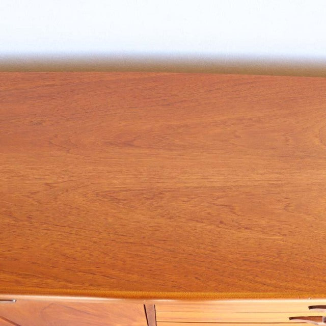 Vintage teak sideboard top surface showing smooth wood grain and warm mid-century finish from British brand Nathan.