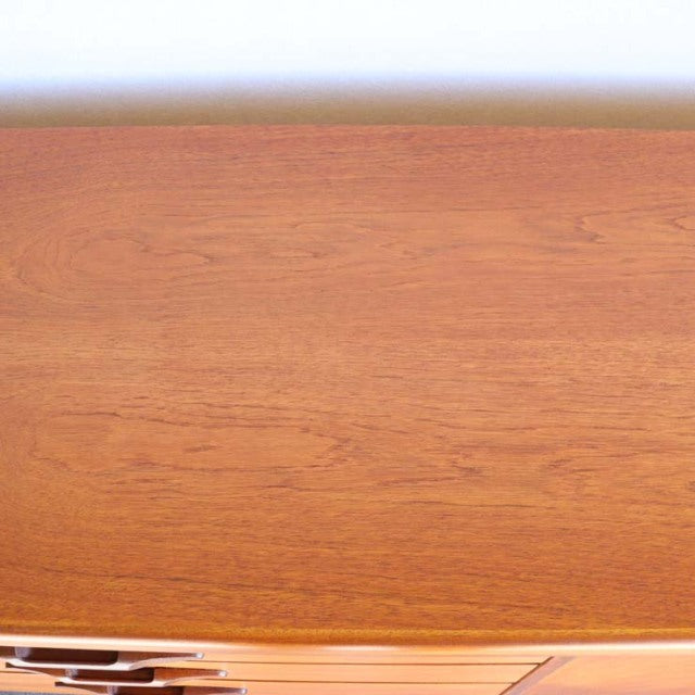 Vintage mid-century teak sideboard by British brand Nathan, featuring smooth wood grain and minimalist design.