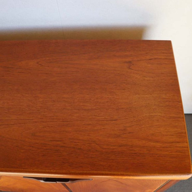 Vintage teak sideboard top showing smooth wood grain and rich color, mid-century British design by Nathan.