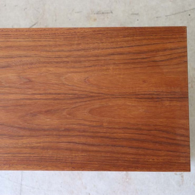 Rectangular teak wood board with rich grain patterns, sleek smooth finish, mid-century British vintage style.