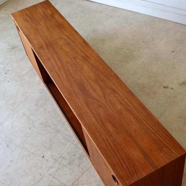 Mid-century British vintage teak lowboard by AVALON with clean lines, visible wood grain, and tapered legs.