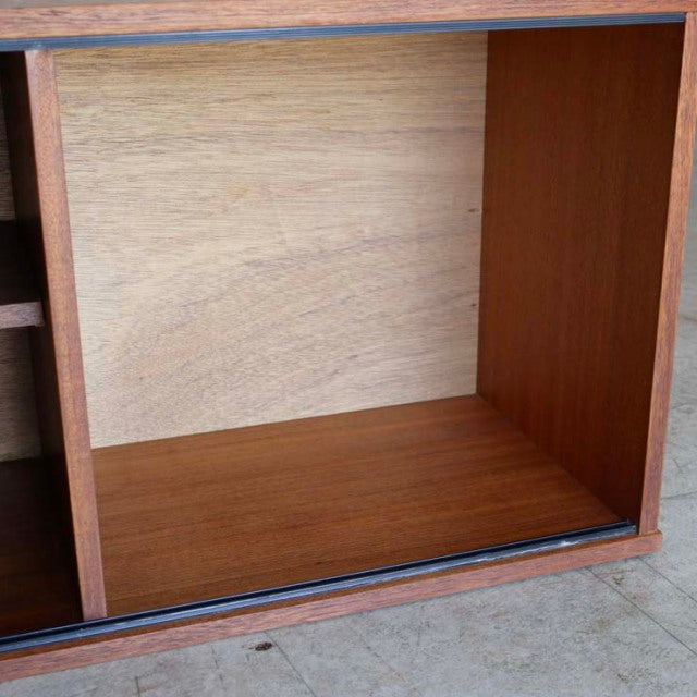 Mid-century British vintage teak lowboard by Avalon with visible wood grain and open compartment.