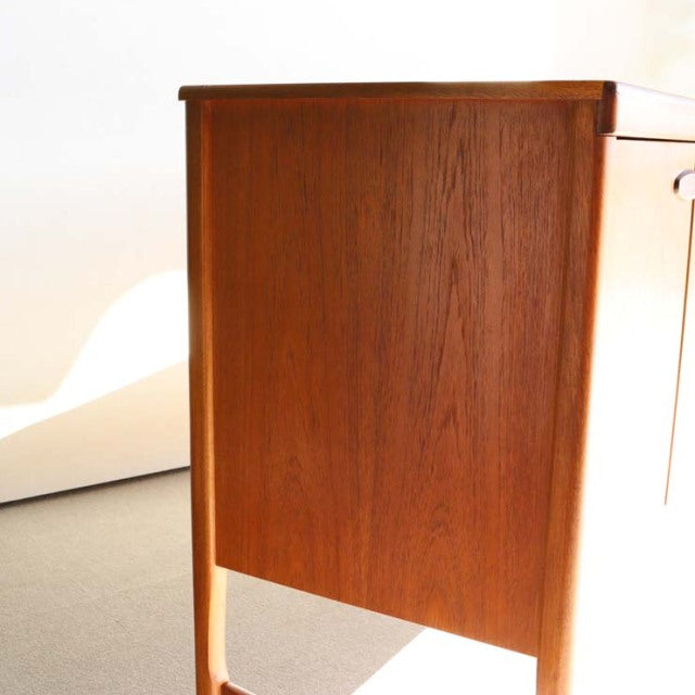 Vintage teak sideboard by Nathan, British mid-century design with clean lines and tapered legs, rich wood grain from Denmark .