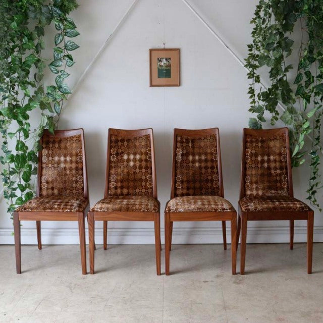 Set of four British G-Plan vintage teak dining chairs with mid-century Danish design, featuring woven cane seats and.