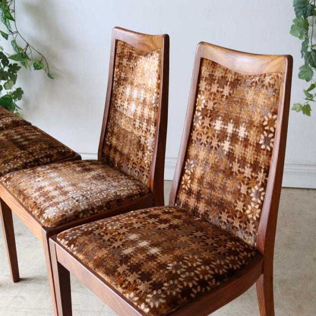 Set of four vintage G-Plan teak dining chairs with mid-century British design and woven patterned upholstery from Denmark.
