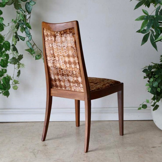G-Plan vintage teak dining chair with mid-century British design, featuring curved legs and patterned fabric backrest and.