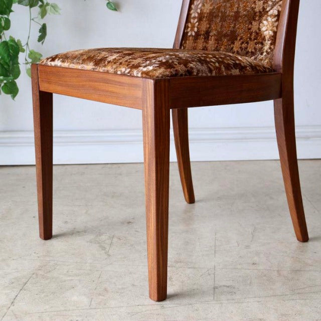 Set of four British vintage mid-century dining chairs with teak frames and textured brown patterned upholstery, showcasing.