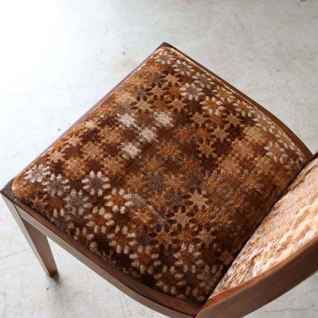 Mid-century British G-Plan dining chair with teak frame and vintage floral-patterned fabric seat cushion.