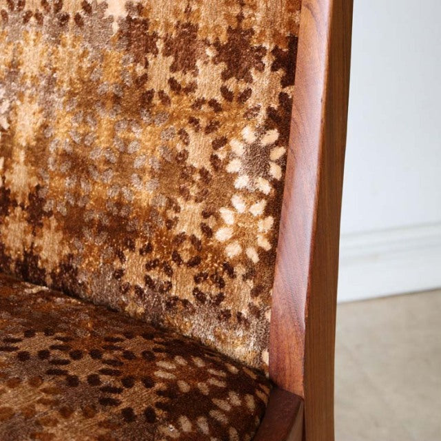 Vintage G-Plan teak dining chair with mid-century British design, angled legs, and floral-patterned brown fabric upholstery.
