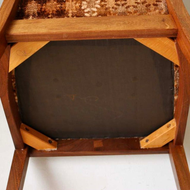Underside view of vintage British G-Plan teak dining chair showing wood grain, solid frame, and sturdy joint construction.