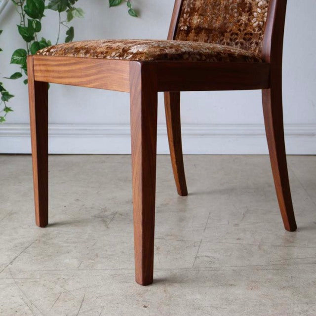 Set of four vintage G-Plan teak dining chairs with clean mid-century British design, tapered legs, and patterned upholstered .