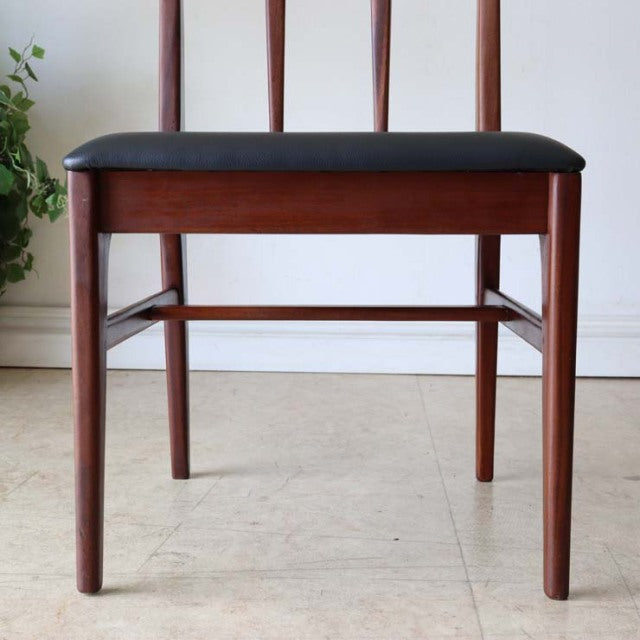 Mid-century British vintage dining chair by A.Younger Ltd., teak frame with slender legs and black upholstered seat.