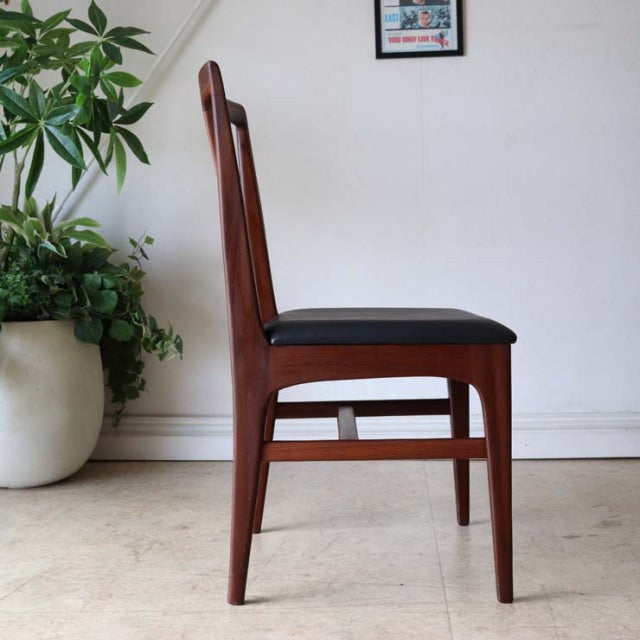 Set of four vintage British teak dining chairs by A.Younger Ltd., mid-century design with slender legs and black upholstered .