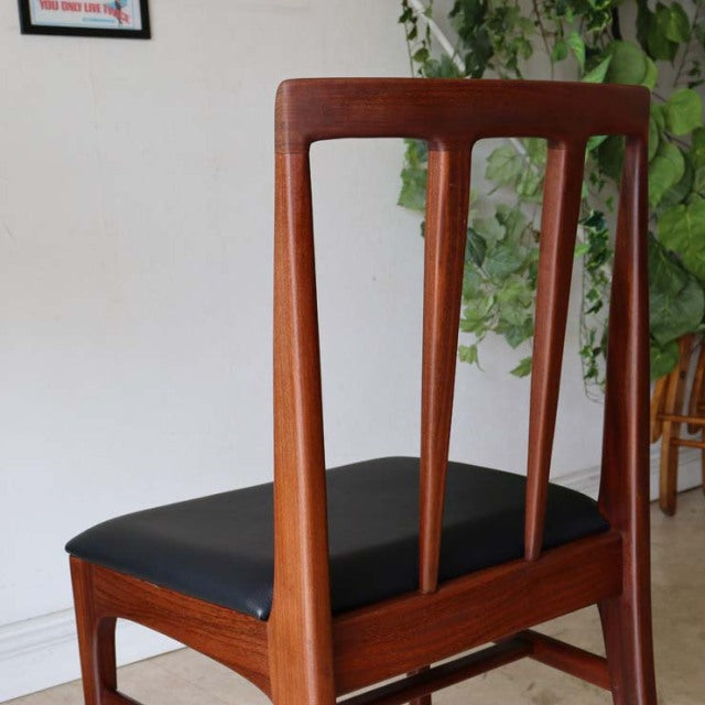Vintage teak dining chair by Younger, British mid-century design with slender vertical back slats and black upholstered seat.