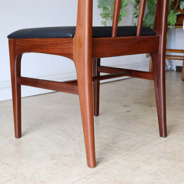 Mid-century British teak dining chair from Younger with sleek tapered legs and visible wood grain.