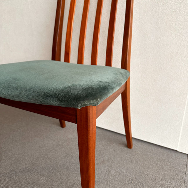 Vintage mid-century teak chair by G-PLAN featuring a slatted backrest and green upholstered seat, showcasing British-Denmark .