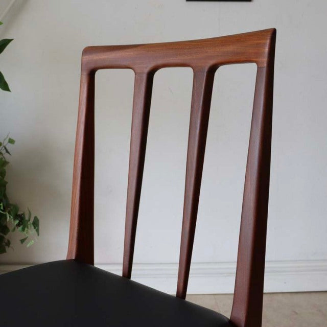 Vintage mid-century teak dining chair by Younger, British-Danish design with slender vertical slats and smooth wood grain.