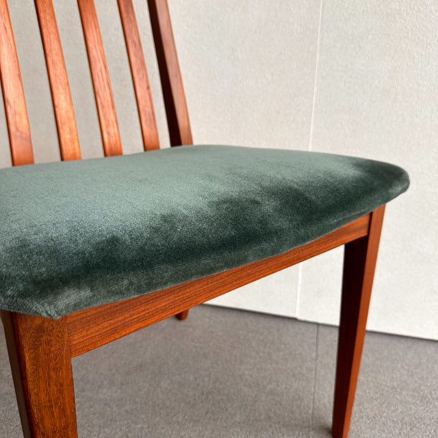 Mid-century British G-PLAN chair with vintage teak frame and dark green velvet upholstered seat.