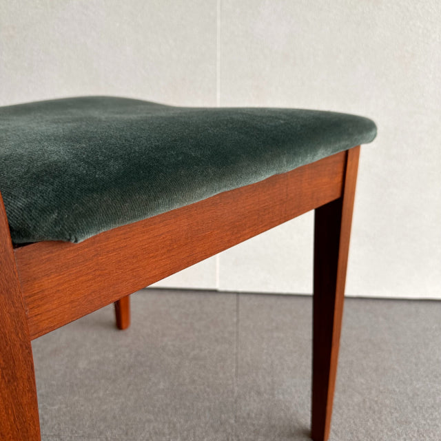 Mid-century British G-PLAN chair with teak frame and dark green vintage upholstered seat, sleek tapered legs.