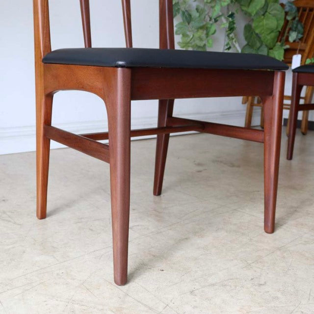Vintage mid-century teak dining chair from British brand Younger with dark cushioned seat and sleek tapered legs.