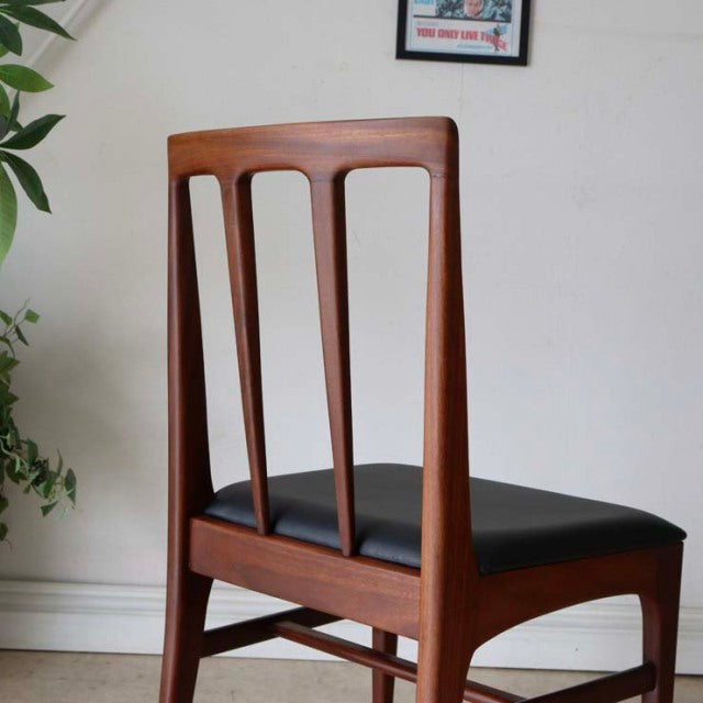 Vintage teak dining chair by Younger with British mid-century design, slim vertical slats, and black upholstered seat.