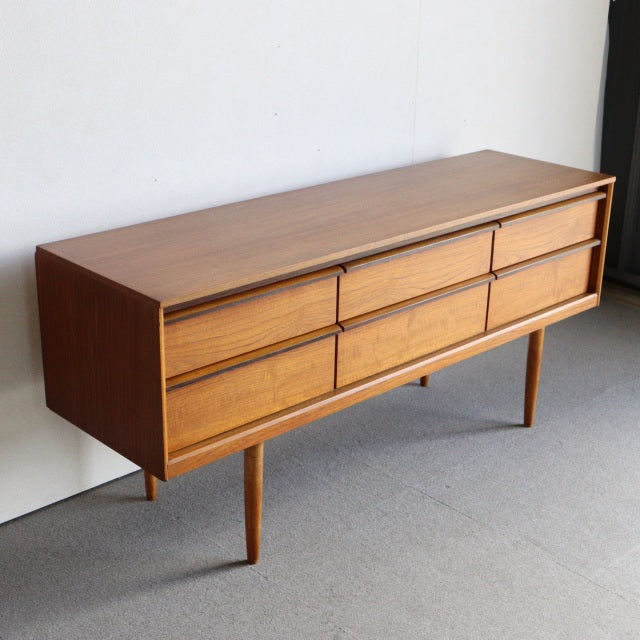 Vintage teak sideboard by Austinsuite, British mid-century design with sleek wood grain and tapered legs.