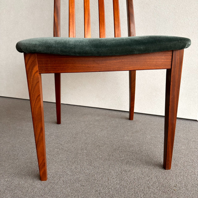 Mid-century British G-PLAN dining chair with teak frame, vertical slat backrest, and dark green upholstered seat cushion.