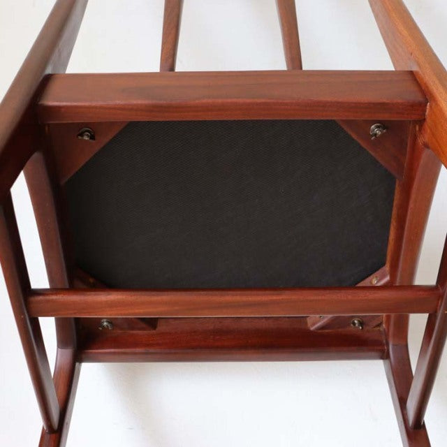 Underside view of mid-century teak dining chair by A.Younger Ltd., showing clean wood grain and sturdy British craftsmanship.