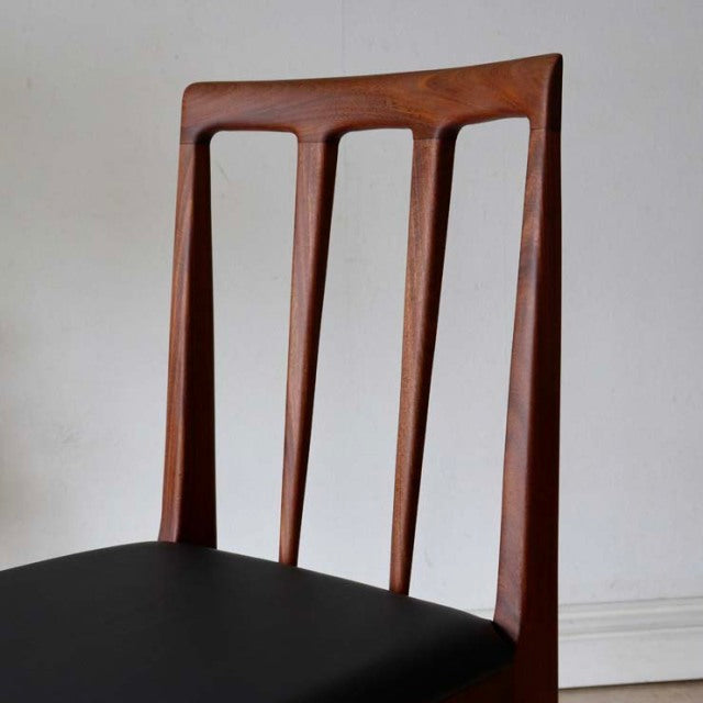 Mid-century British vintage dining chair by A.Younger Ltd., teak frame with distinctive wood grain and black seat upholstery.