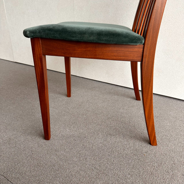 Mid-century British G-PLAN dining chair with teak frame, rich wood grain, and dark green upholstered seat.