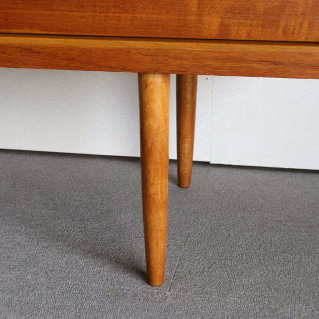 Mid-century teak sideboard legs with warm wood grain, tapered round shape, British-Denmark vintage style by Austinsuite.