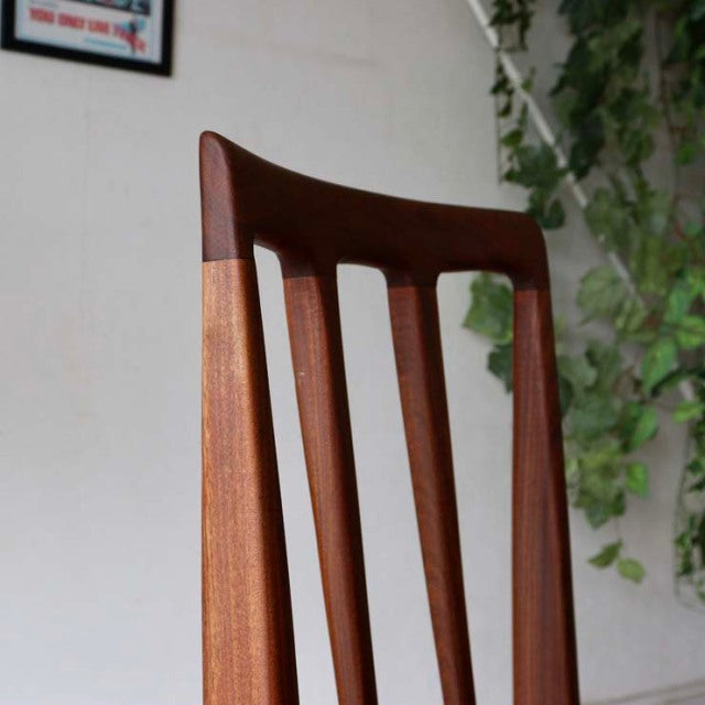 Vintage teak dining chair from Younger, British mid-century design with slender vertical slats and tapered legs, showcasing.