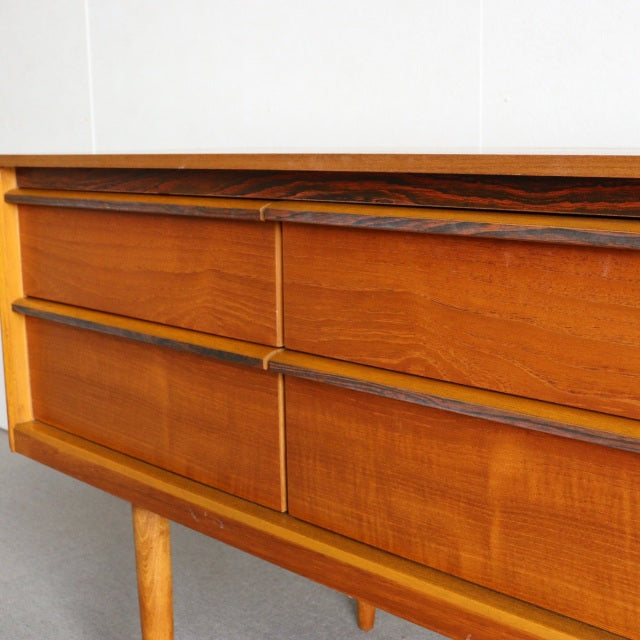 Vintage teak sideboard by Austinsuite with rich wood grain, tapered legs, and mid-century British-Denmark design.