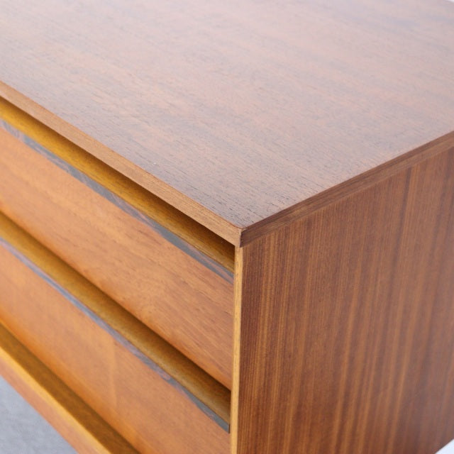 Vintage teak sideboard by Austinsuite showcasing mid-century British-Denmark design, smooth wood grain, and clean lines.