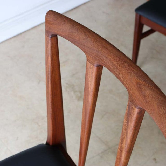 Vintage teak dining chair by Younger featuring mid-century British design from Denmark with sculpted wood grain backrest and .