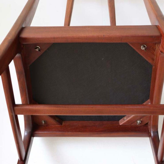 Vintage teak dining chair from Younger, British mid-century design with visible wood grain and sturdy legs seen from below.