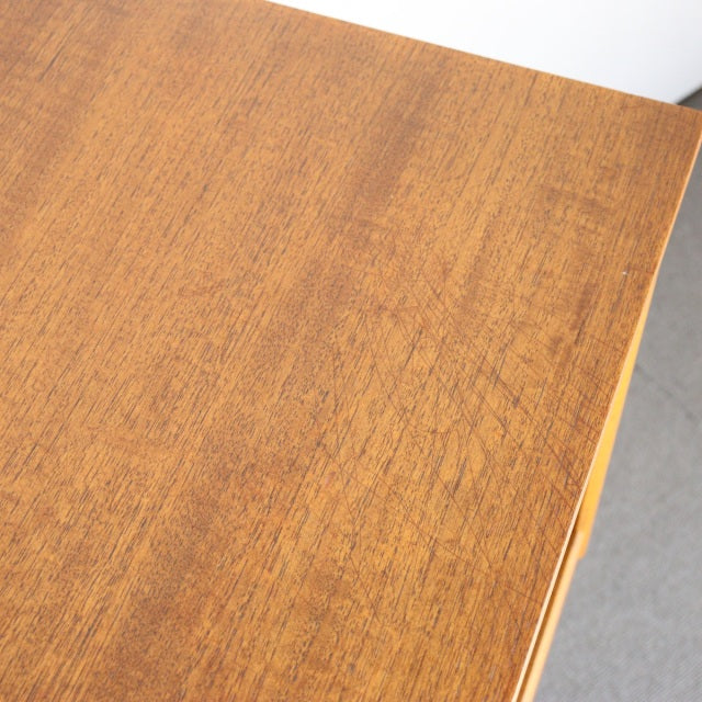 Vintage teak sideboard top showing rich wood grain and warm mid-century British-Denmark craftsmanship.