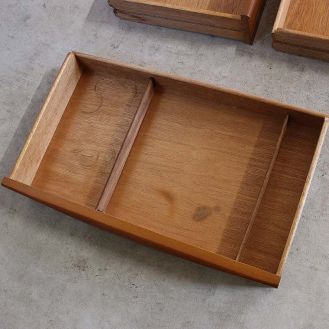 Vintage teak drawer with mid-century British design, showcasing unique wood grain and smooth finish.