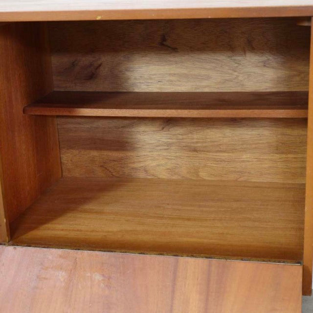 Mid-century vintage teak sideboard interior with visible wood grain and elegant shelf, British-Denmark design.