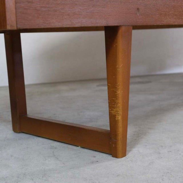 Mid-century British vintage teak sideboard leg with rich wood grain and distinctive rounded handle, Danish-inspired design.