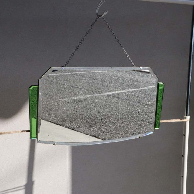 Vintage British mid-century teak wall mirror with green glass side panels, rectangular shape, hung by metal chain.